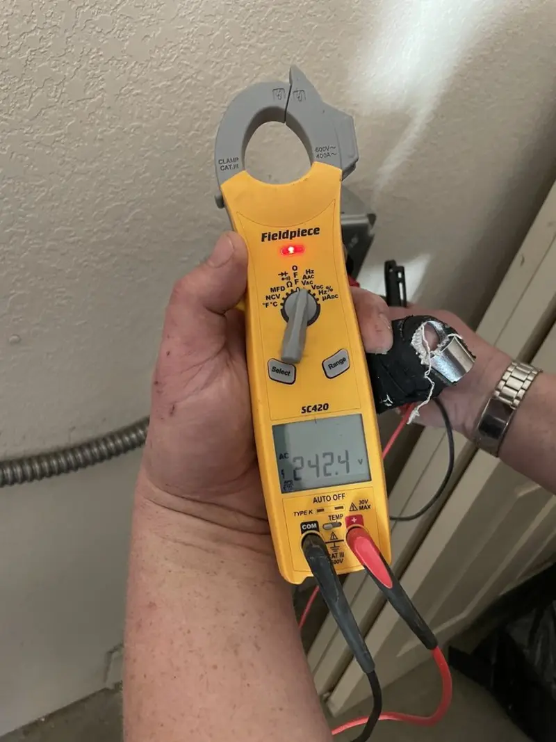 Voltage testing with clamp meter during Outlet Installation in Grove